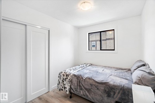 Bedroom featuring light wood-style floors and a closet - 38 Woodcrest Avenue, St. Albert, AB - Indoor Photo Showing Bedroom