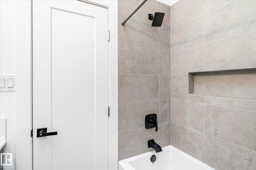Bathroom featuring bathing tub / shower combination - 38 Woodcrest Avenue, St. Albert, AB - Indoor Photo Showing Bathroom