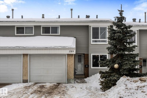 Traditional-style house featuring an attached garage and brick siding - 289 Grandin Village, St. Albert, AB - Outdoor