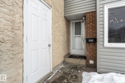 Doorway to property with stucco siding - 