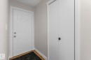 Doorway featuring wood finished floors and baseboards - 289 Grandin Village, St. Albert, AB  - Indoor Photo Showing Other Room 