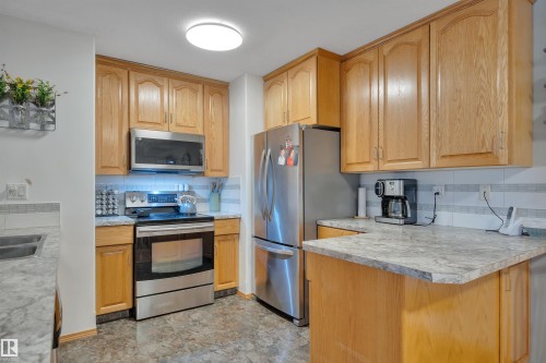 306 4604 48A Street, Leduc, AB - Indoor Photo Showing Kitchen With Stainless Steel Kitchen