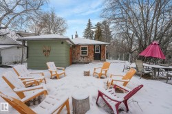 Snow covered patio with outdoor dining area and a deck - 