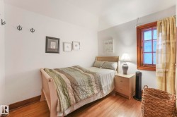 Bedroom featuring wood finished floors and baseboards - 