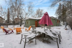 Snow covered patio featuring outdoor dining area and a patio area - 