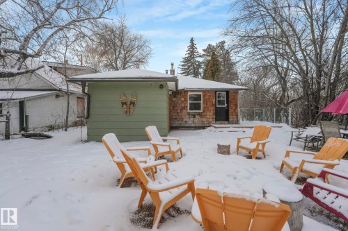 View of snow covered back of property - 5043 48 St, Sylvan Lake, AB - Outdoor With Deck Patio Veranda