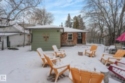 View of snow covered back of property - 