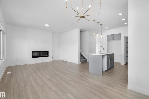 4182 Kinglet Drive, Edmonton, AB - Indoor Photo Showing Other Room With Fireplace