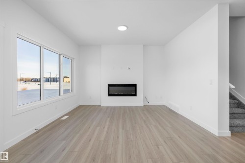 4182 Kinglet Drive, Edmonton, AB - Indoor Photo Showing Other Room With Fireplace