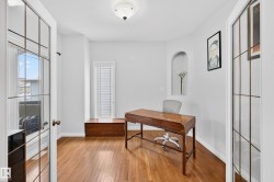 Office featuring french doors, light wood finished floors, and healthy amount of natural light - 