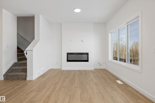 4184 Kinglet Drive, Edmonton, AB - Indoor Photo Showing Other Room With Fireplace