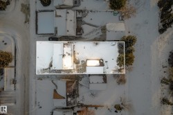 Aerial view of property and surrounding area featuring property boundaries highlighted - 