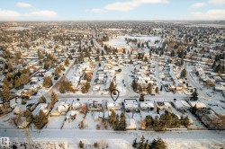 Snowy aerial view featuring a residential view - 