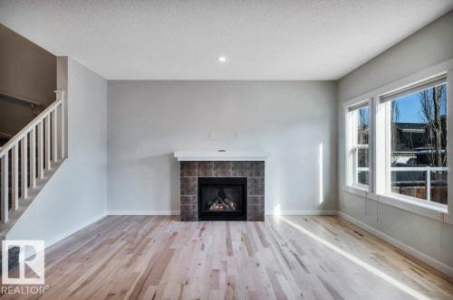 237 Sheppard Circle, Leduc, AB - Indoor Photo Showing Living Room With Fireplace