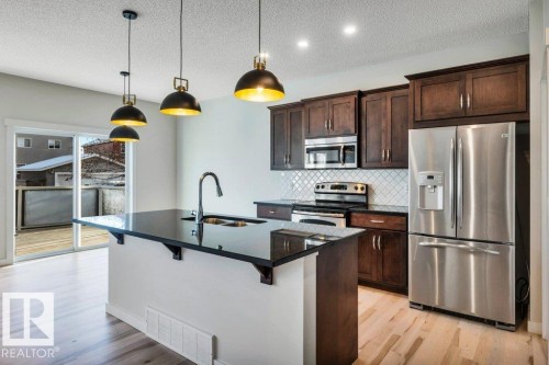 237 Sheppard Circle, Leduc, AB - Indoor Photo Showing Kitchen With Double Sink With Upgraded Kitchen