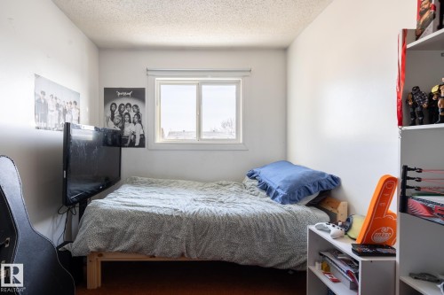 Bedroom with a textured ceiling - 1346 Lakewood Road W, Edmonton, AB - Indoor Photo Showing Bedroom