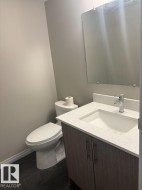 Half bathroom with vanity and toilet - 