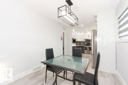 Dining area featuring light wood finished floors and recessed lighting - 