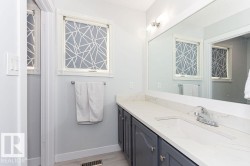 Bathroom featuring vanity and light wood-style floors - 