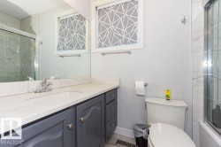 Full bathroom featuring vanity and tiled shower / bath combo - 