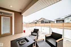 Fenced backyard featuring a patio and outdoor lounge area - 
