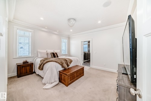 Bedroom featuring light carpet, crown molding, and recessed lighting - 6 Wade Avenue, Leduc, AB - Indoor Photo Showing Bedroom