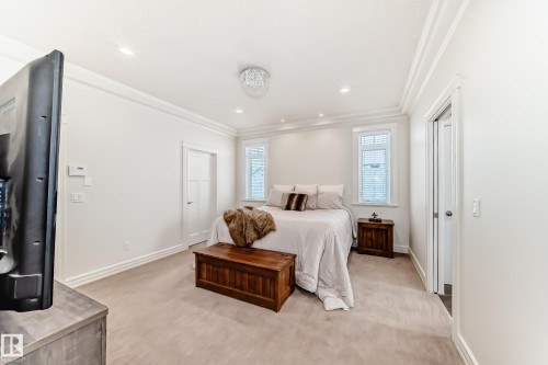 Bedroom featuring light colored carpet, crown molding, and recessed lighting - 6 Wade Avenue, Leduc, AB - Indoor Photo Showing Bedroom