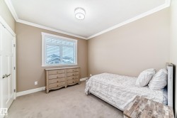 Bedroom with carpet floors and ornamental molding - 