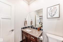 Bathroom featuring vanity and ornamental molding - 