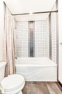 Full bath with shower / tub combo and tile patterned flooring - 