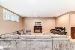 Living area featuring light colored carpet and recessed lighting - 