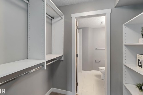 Walk in closet featuring light tile patterned floors - 101 3670 139 Avenue, Edmonton, AB - Indoor