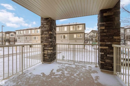 Snow covered back of property featuring a residential view - 101 3670 139 Avenue, Edmonton, AB - Outdoor With Balcony With Exterior