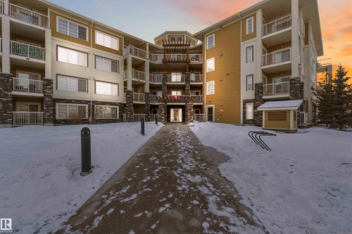 Snow covered property with a view of apartment building / complex - 101 3670 139 Avenue, Edmonton, AB - Outdoor With Balcony With Facade