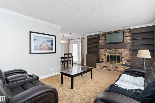 1115 82 Street, Edmonton, AB - Indoor Photo Showing Living Room With Fireplace
