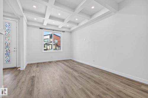 Spare room with coffered ceiling, beam ceiling, light wood-style floors, and recessed lighting - #5 15805 97 Ave, Edmonton, AB - Indoor Photo Showing Other Room