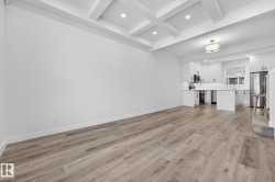 Unfurnished living room featuring recessed lighting, beam ceiling, and light wood-type flooring - 