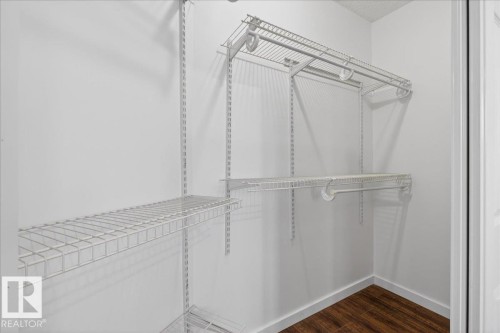 Walk in closet featuring dark wood-style floors - 2516 42 Street, Edmonton, AB - Indoor With Storage
