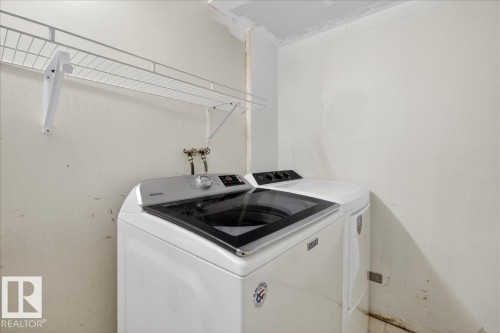Laundry room with washing machine and dryer - 2516 42 Street, Edmonton, AB - Indoor Photo Showing Laundry Room