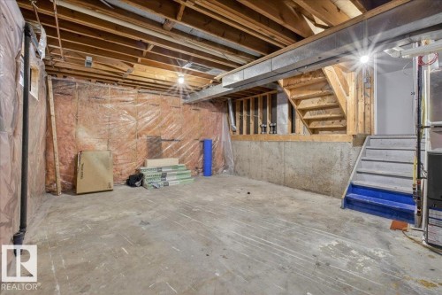 Unfinished below grade area with stairway - 2516 42 Street, Edmonton, AB - Indoor Photo Showing Basement