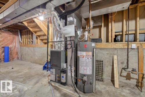 Utilities with water heater - 2516 42 Street, Edmonton, AB - Indoor Photo Showing Basement