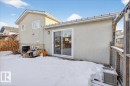 Snow covered back of property featuring stucco siding - 2516 42 Street, Edmonton, AB  - Outdoor With Exterior 