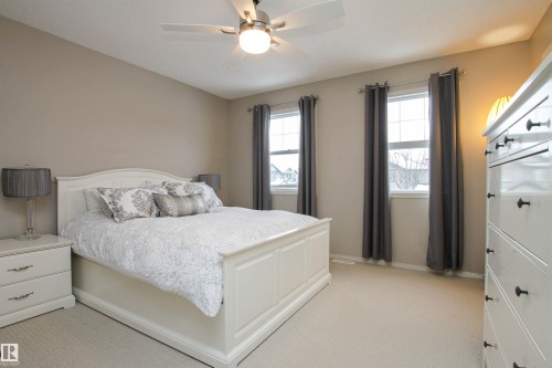 Bedroom with light colored carpet and ceiling fan - 2315 Lemieux Place, Edmonton, AB - Indoor Photo Showing Bedroom