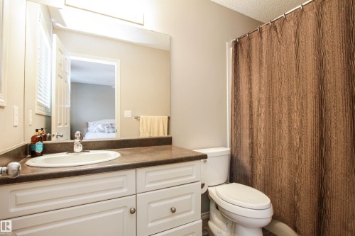 Ensuite bathroom with a shower with curtain and vanity - 2315 Lemieux Place, Edmonton, AB - Indoor Photo Showing Bathroom