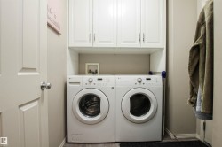 Laundry area with cabinet space and separate washer and dryer - 