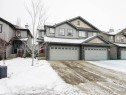 View of front of property with stone siding and a garage - 2315 Lemieux Place, Edmonton, AB  - Outdoor With Facade 