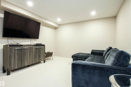 Living room with carpet flooring and recessed lighting - 2315 Lemieux Place, Edmonton, AB - Indoor Photo Showing Basement