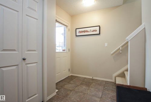 Entryway featuring a textured ceiling and stairway - 2315 Lemieux Place, Edmonton, AB - Indoor Photo Showing Other Room