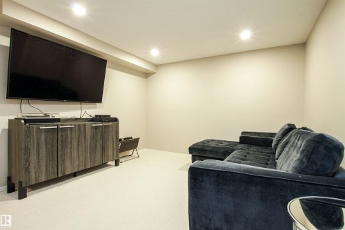 Carpeted living area featuring recessed lighting and baseboards - 2315 Lemieux Place, Edmonton, AB - Indoor Photo Showing Basement