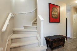 Stairway with baseboards and a textured ceiling - 